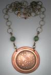 Mokume Gane Circle Pendanat-3, Dia.=1 ¾; Hand sculpted pendant with a bronze and copper Mokume Gane dome on an antiqued copper circle, framed with an 8mm Jade bead on each side .  Hangs on a 22 adjustable, antiqued bronze chain.Dia. 2;   Hand-sculpted circular pendant with a domed, Mokume Gane center and 2 - 8mm Mokume Gane bead on each side.  Hangs on a 19 to 21 antiqued bronze adjustable chain.