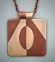 Bronze and copper inlay pendant; 1.75 x 1.50 with 26 adjustable copper chain