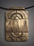 Bronze Mosaic Pendant, Nature & Industry Series #2; Bronze mosaic of leaves and gears measuring 1 ½h x 1 ¼w hanging on 16 wrapped stainless steel or on adjustable-22 chain.