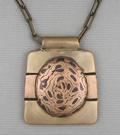 Bronze/Copper/Steel Mokume Gane on Bronze/Copper backing; 1 7/8  x 1 5/8; 19 chain adjustable