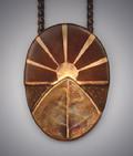 “Sunrise”: Copper pendant with bronze leaf and bronze inlay of setting sun on copper backing. Measures 2”h x 1 ½”w and hangs on 19" copper chain.