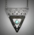 Steel V Pendant - Labradorite;  L=  2   W= 1 3/4;  Hand sculpted steel pendant.   Triangle shaped, 2 piece steel within which hangs a 8x9mm Labradorite briolette gemstone.  Hangs on a 24 chain.