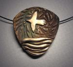 “Bird in Flight”;  Bronze pendant with bird flying over the ocean. Pendant measures 11/2"w x 1 5/8h and hangs on Memory Wire.