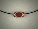 "Mokume Gane Bead"; Copper and bronze Mokume Gane bead, ½h x 3/8w, hanging on Memory Wire.