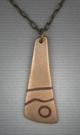 Bronze pendant with Copper inlay