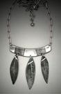 Steel 3 Leaf Necklace; L=  2 ½    W= 2 1/4  Steel necklace, horizontal bar from which hang 3 steel leaves.  18-20 adjustable steel chain.