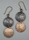 Bronze/Steel Sm. 2 circle earrings; L= 2 1/8 (including ear wire)  W= 3/4 2 domed spheres of steel and bronze with pattern of leaves and branches.