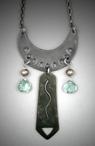 Steel Crescent Pendant Aqua-crystal; L=  2 ½   W= 1 3/8;   Hand sculpted steel crescent pendant.  From the Steel crescent hangs a 1 ½ steel rectangle flanked by two 8x8mm Aqua-crystal briolette gemstones and solid bronze beads.  Hangs on a 26 chain.
